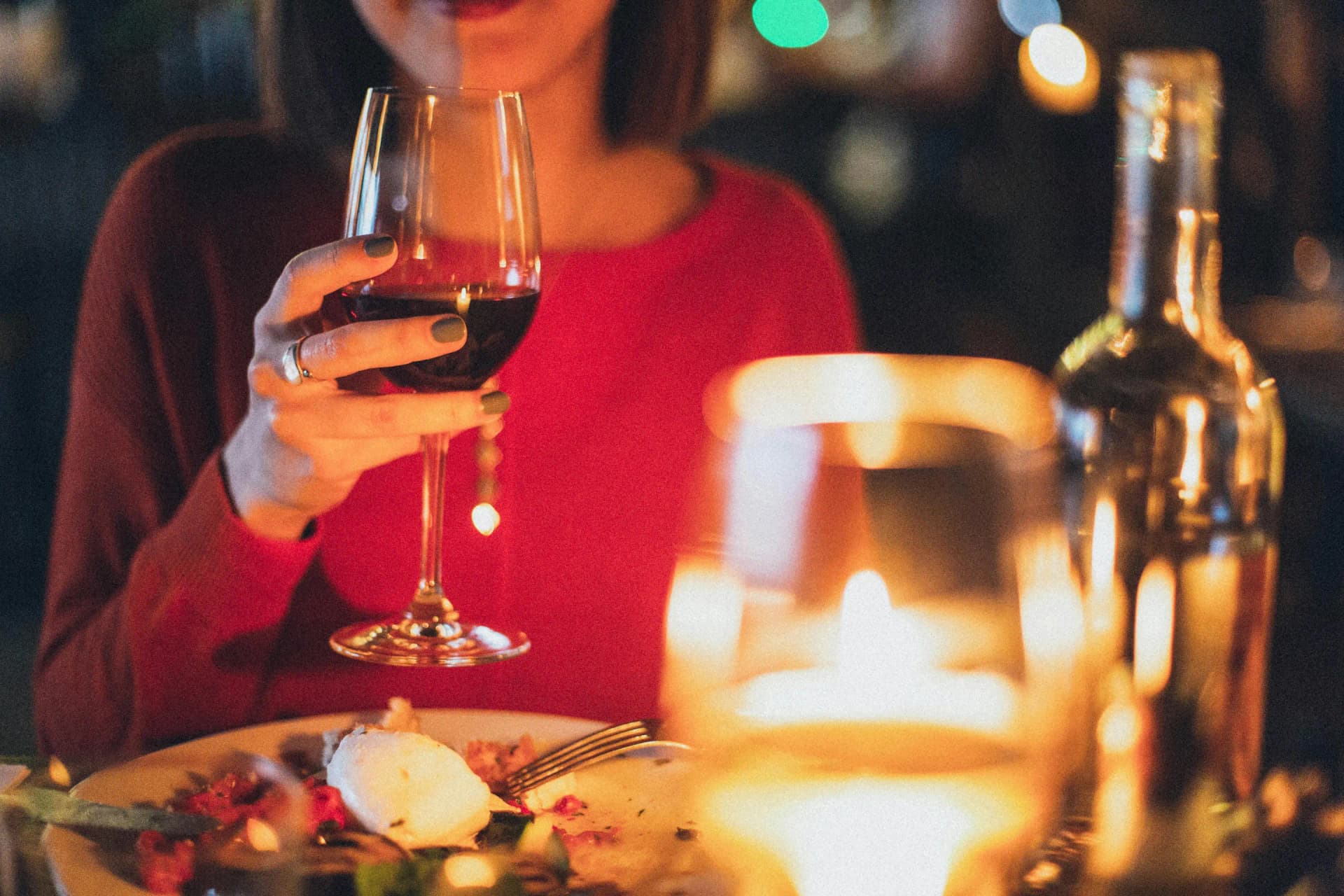 Woman at dinner eating and drinking
